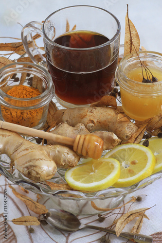  lime broth with honey, lemon and ginger  оn the glass vase photo