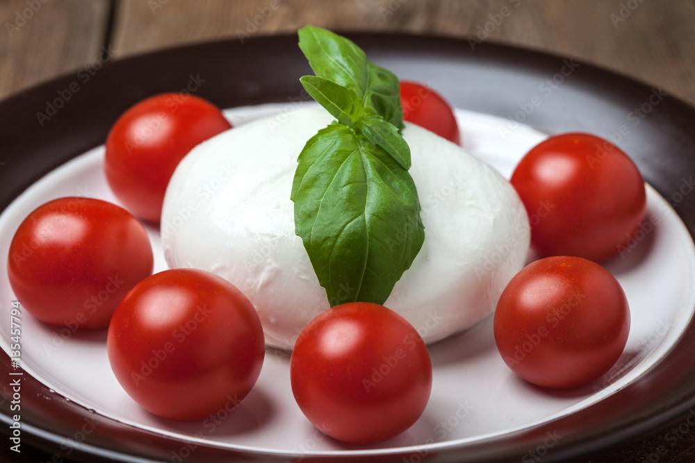 Mozzarella, tomato and basil. Mozzarella, tomato and basil.
