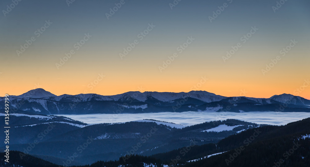 Winter landscape with sunset in mountains