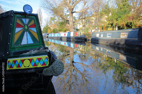 LONDON, UK: Reflections in Little Venice with colorful barges along canals photo