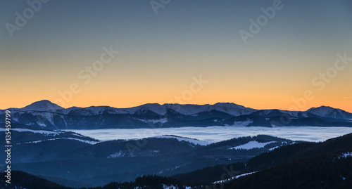 Winter landscape with sunset in mountains
