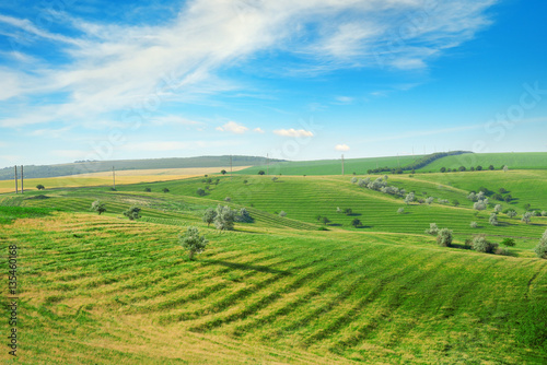 Hilly terrain with a terrace and a blue sky