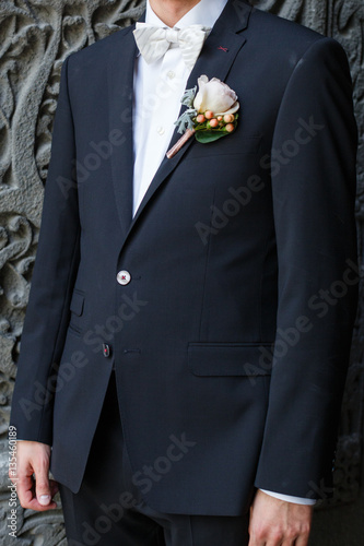 man wearing jacket with a buttonhole