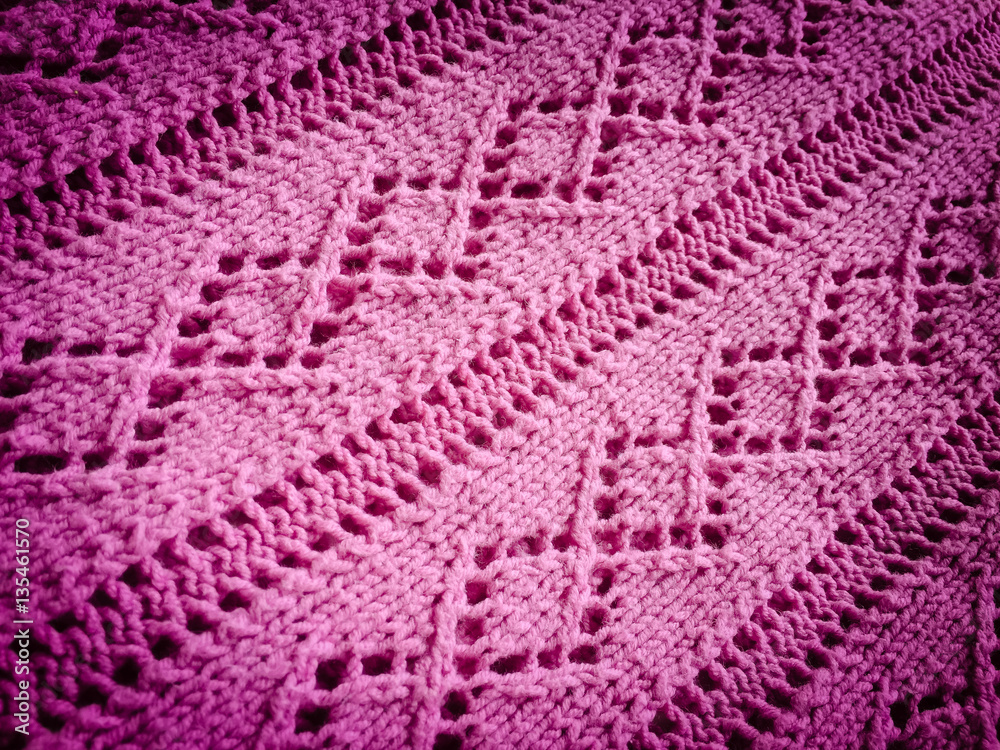 Beautiful crafted pink wool knitted background, natural soft surface
