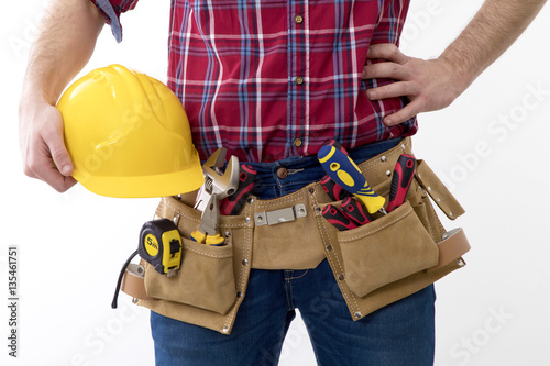 bricklayer with helmet and belt of tools isolated in background white photo