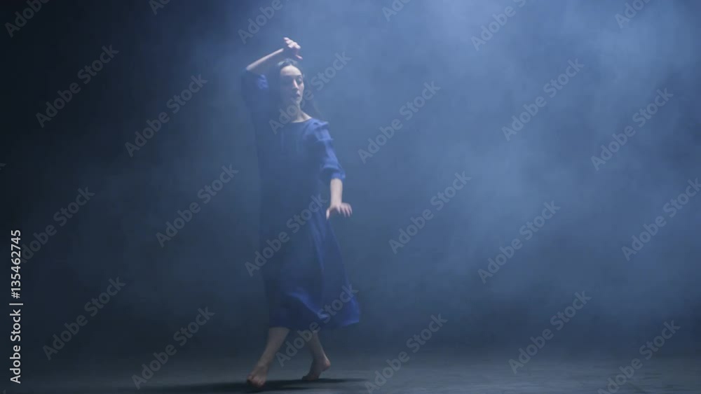 Young Woman Waving Her Hands in Artificial Fog Young Woman Waving Her Hands in Artificial Fog