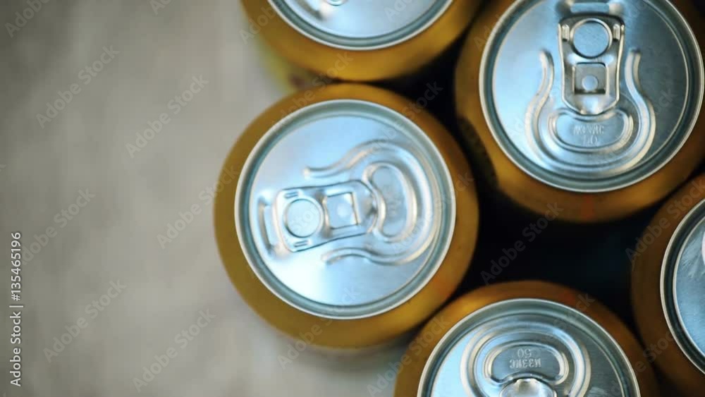 Six beer cans on wooden table, top view of alcoholic beverage Six beer cans on wooden table, top view of alcoholic beverage