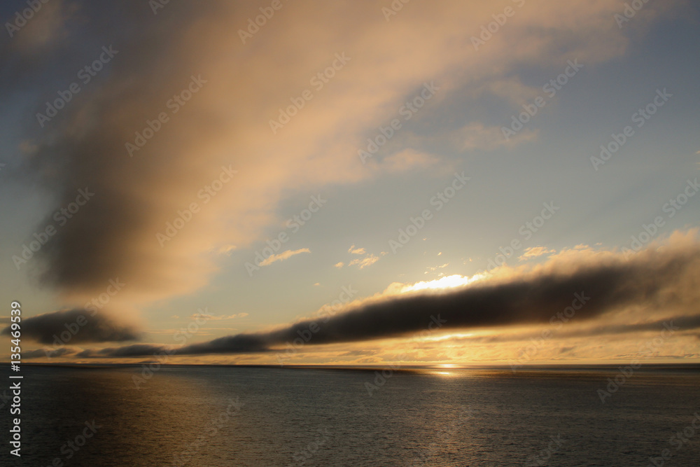 Low clouds over the sea at sunset