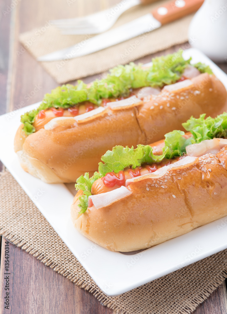 fast food,hot dogs with various ingredients on wood background fast food,hot dogs with various ingredients on wood background
