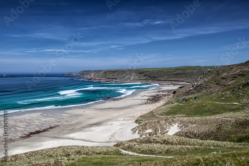 Sandy beach on summer day with blue sky in Cornwall  England