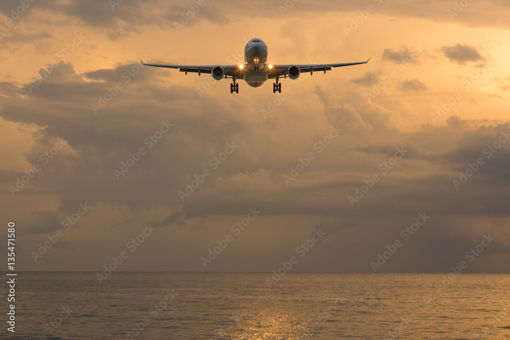 Landscape of sunset with Plane at Nai Yang Beach, Phuket Provinc