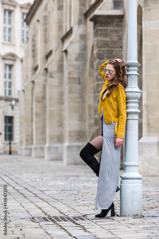 Fashionable brunette woman yellow jacket