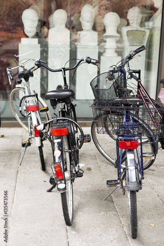 Photos Student bikes against ancient art museum