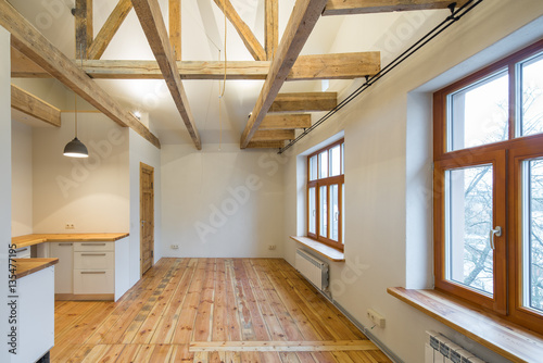 Wooden design. Room studio with a kitchen. Big wooden window.