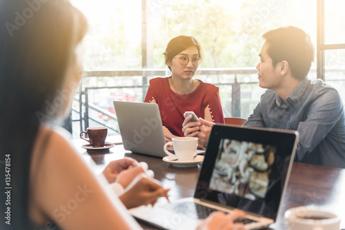 Wallpaper Mural 4 people meeting in coffee shop, business casual conceptual Torontodigital.ca