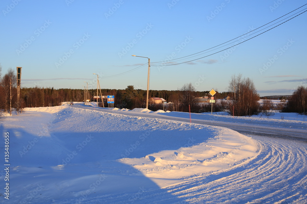 Rural road in winter, Lapland, Finland