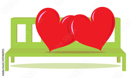 two red heart lean to each other on green bench
