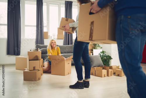 Group of friends moving into new apartment