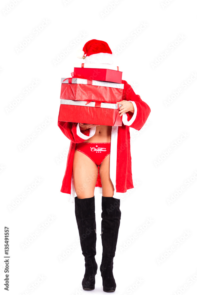 Frau im sexy Nikolaus Kostüm schleppt viele Geschenke Stock Photo | Adobe  Stock