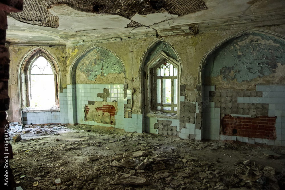 Ruined interior of an abandoned mansion of Khvostov in gothic style 