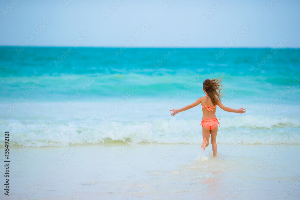Little girl at beach during summer vacation Little girl at beach during summer vacation