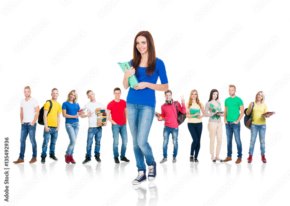 Obraz premium Large group of teenage students isolated on white background. Many different people standing together. School, education, college, university concept.