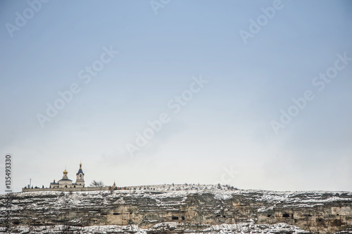 monastery on mountain  in winter