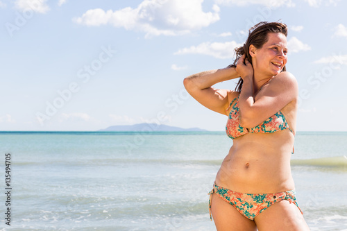 Girl at the natural beach Cala di Forno in Italy