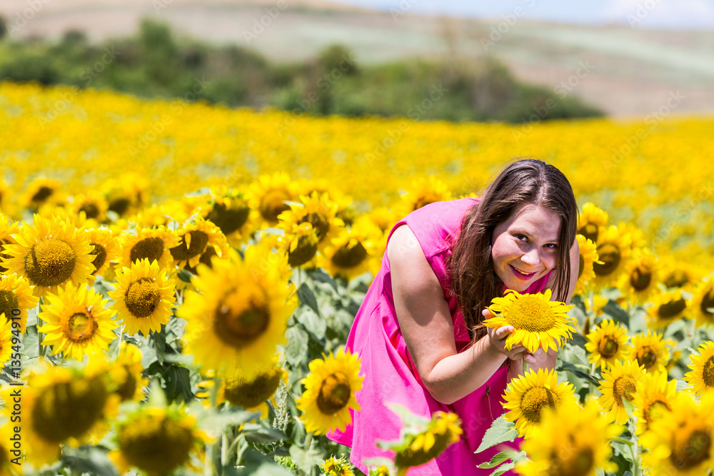 Girl standing in the Tuscan fields in summer Girl standing in the Tuscan fields in summer