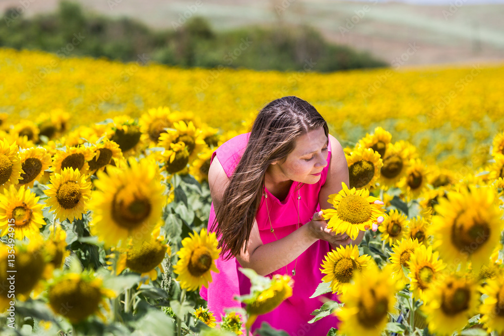 Girl standing in the Tuscan fields in summer Girl standing in the Tuscan fields in summer