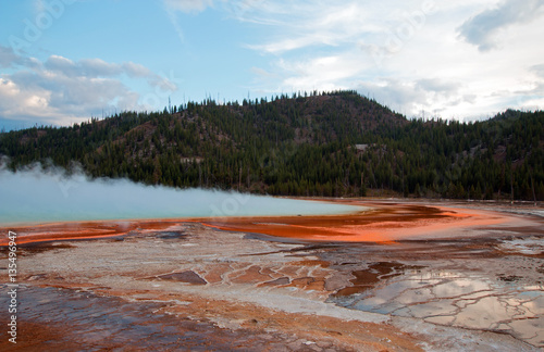 Grand Prismatic Spring under sunset clouds in Yellowstone National Park in Wyoming USA