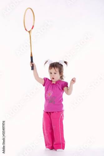 photo of little girl playing badminton