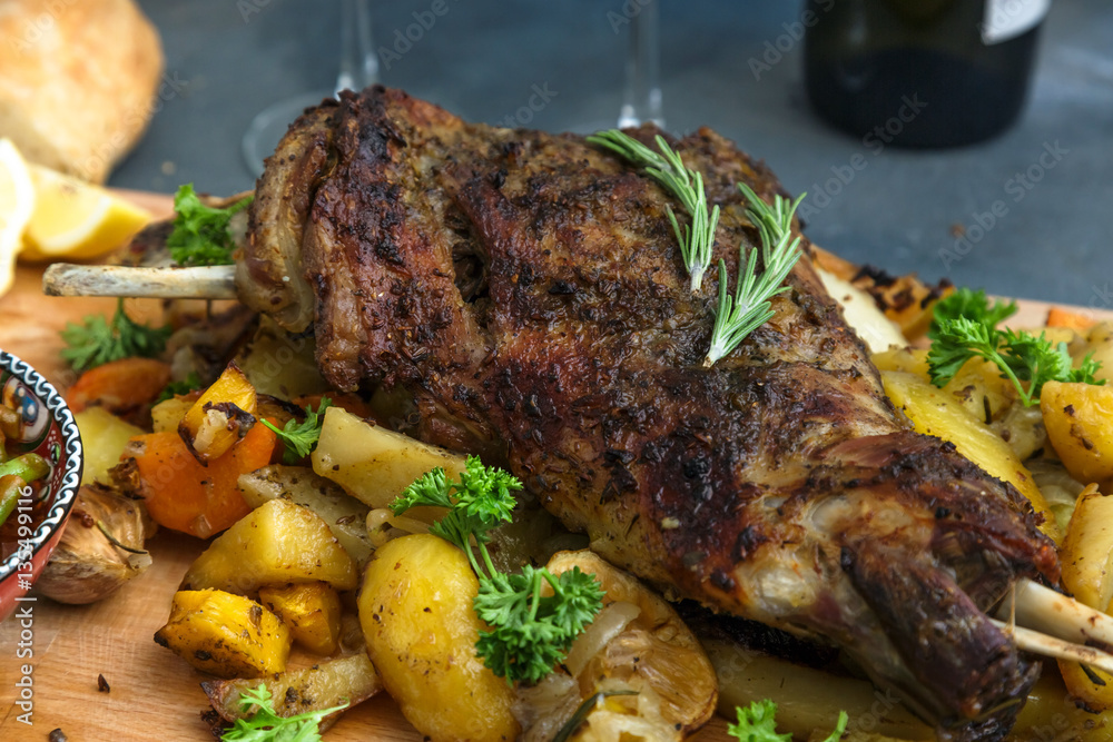 Roast lamb shoulder with baked vegs, close view