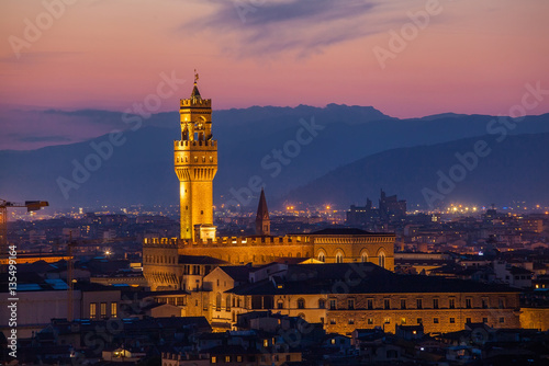 Beautiful view of Palazzo Vecchio in evening illumination and the river Arno, Florence, Italy