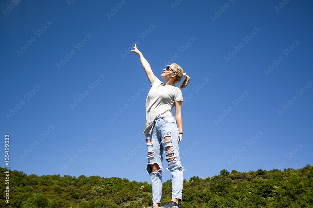 lifestyle concept - beautiful happy woman enjoying summer outdoors.
Young woman relaxing in summer day. People freedom style. lifestyle concept - beautiful happy woman enjoying summer outdoors.
Young woman relaxing in summer day. People freedom style.