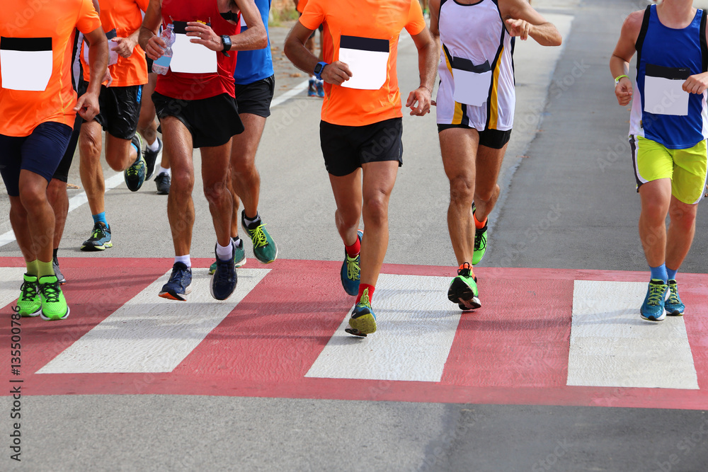 Naklejka premium Runners during a race athletics on the road