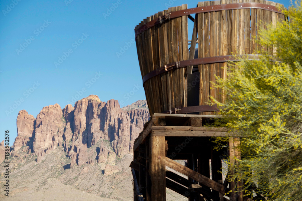 Old rough wooden water tower in the desert
