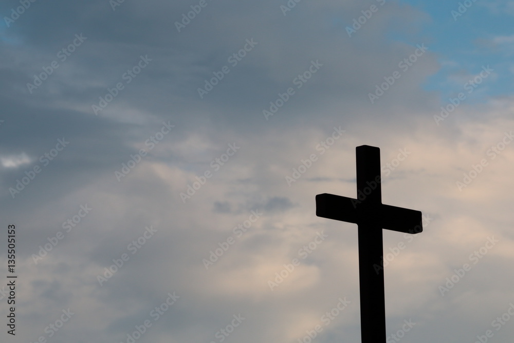 silhouette of the cross on a cloudy sky