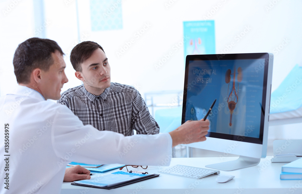 Medical concept. Doctor showing results of urology diagnostic on computer monitor Medical concept. Doctor showing results of urology diagnostic on computer monitor