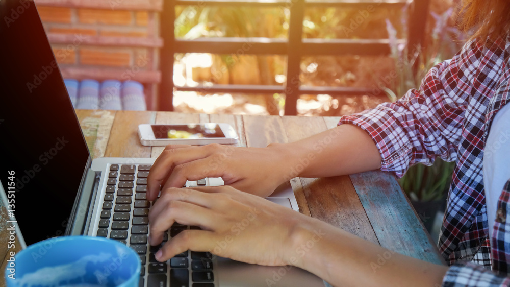 Obraz premium hand control on a laptop touchpad