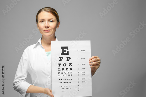 Young doctor holding eyesig...