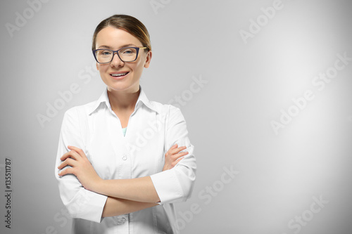 Young woman on grey background