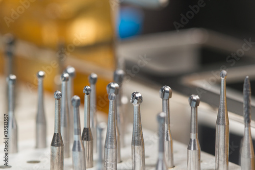 Extensions and drill bits for dental machine