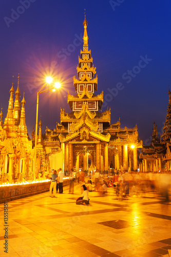 Temples at the Shwedagon Pagoda in Yangon Myanmar at sunset 