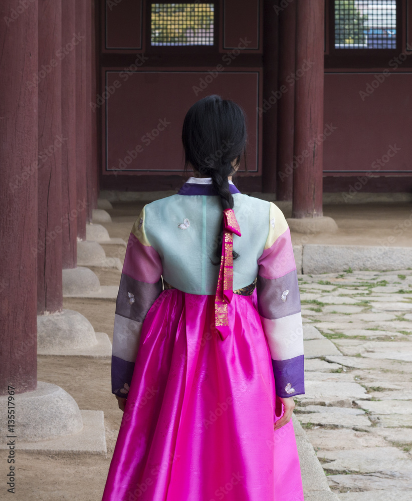 Beautiful girl in Hanbok at Gyeongbokgung, the traditional Korean dress