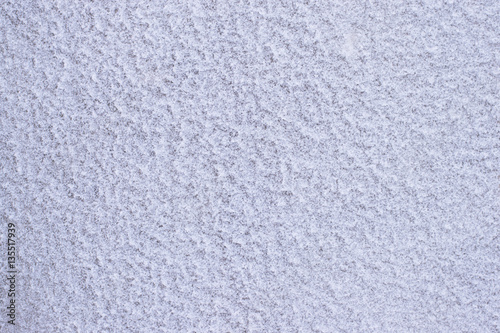 crystalline structure of the frozen snow on the wall.