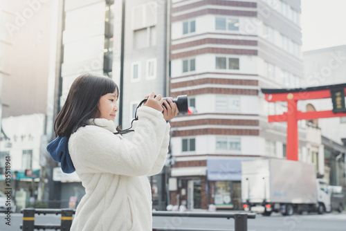 Photography Asian girl with camera taking pictures