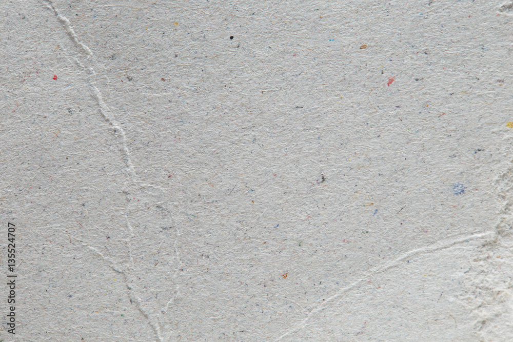 Obraz premium close up of gray cardboard with colored speckles