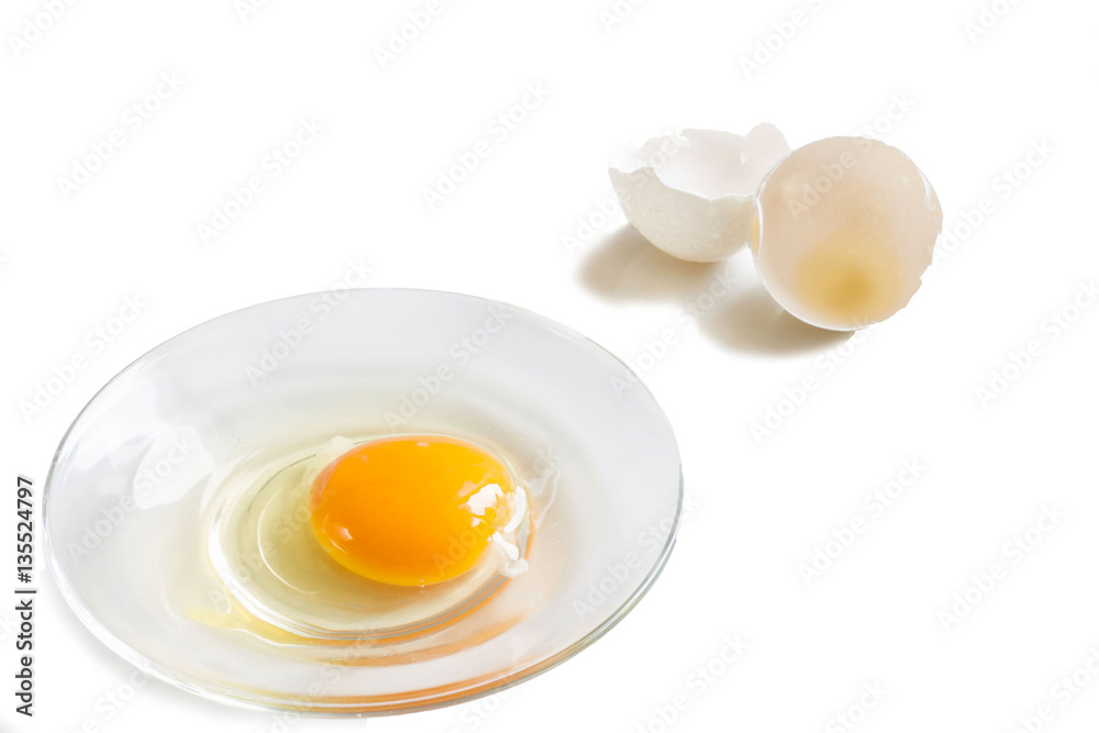fresh homemade broken egg on a saucer with a cover fresh homemade broken egg on a saucer with a cover