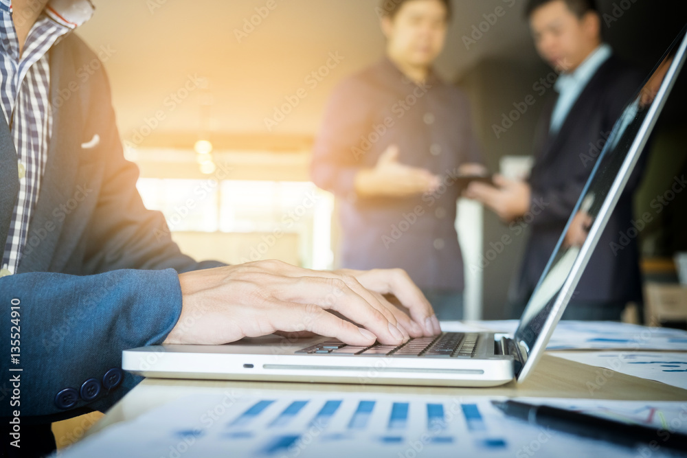 Fototapeta premium working on laptop, close up of hands of business man